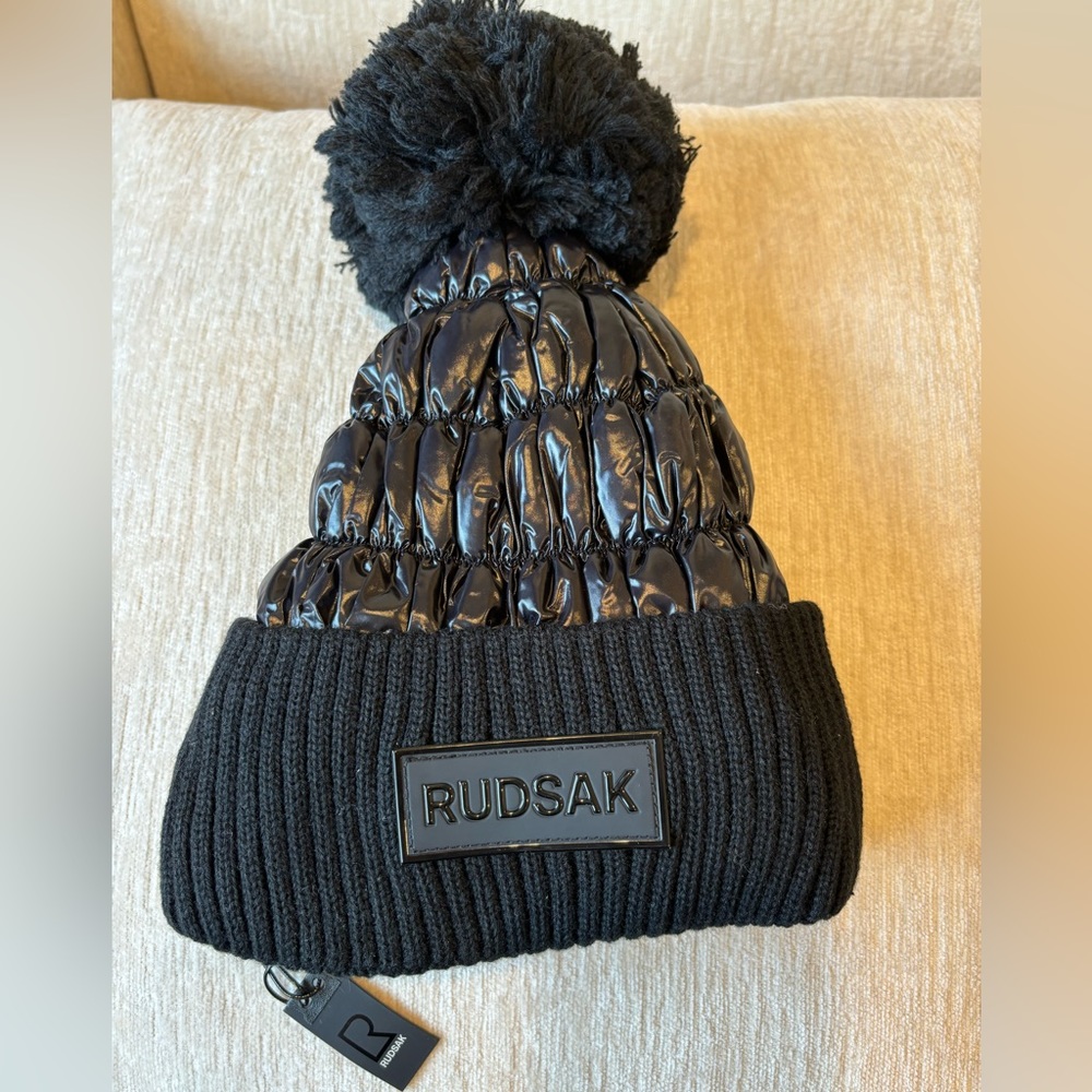 RUDSAK Lanya Women’s Pom Pom Hat. Quilted Black Nylon. One Size Fits Most.